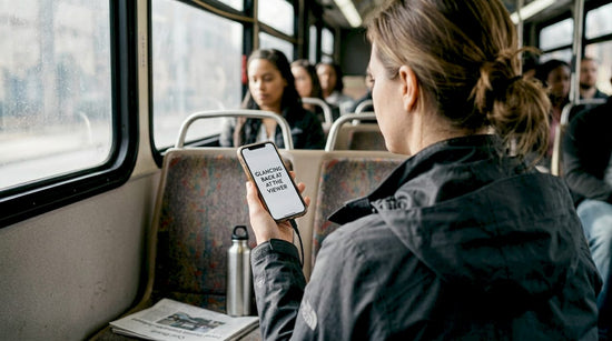Professional woman commuting in smart jacket checks phone