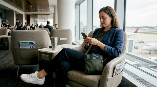 Stylish traveler with smart bag in airport